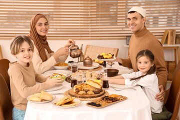 Wall Mural - Muslim family having dinner at home. Ramadan celebration