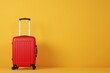 a red suitcase is sitting on a yellow background