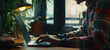 Focused Entrepreneur Typing on Laptop in Modern Cafe Workspace