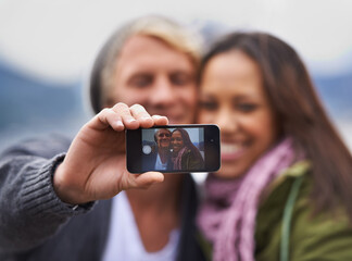 Canvas Print - Phone screen, selfie and couple hug in nature for travel, freedom or road trip adventure together. Smartphone, photography and people with love in a forest for camping, journey or social media memory