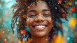 Portrait of a beautiful young african american woman with afro hairstyle and confetti