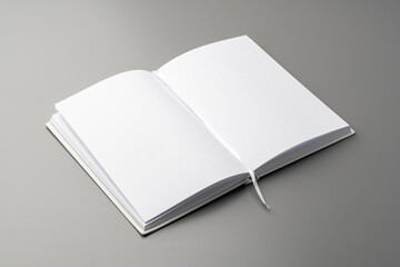 Poster - Blank notepad on gray background studio shot