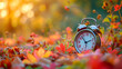 Daylight saving time ends. Alarm clock on beautiful nature background with summer flowers and autumn leaves, generative ai 