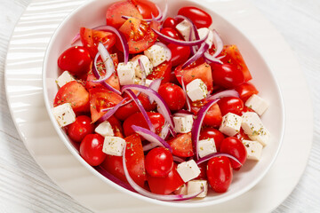 Canvas Print - tomato salad with red onion and white cheese