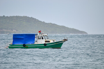 Wall Mural - fishing boat in the sea at izmir, urla