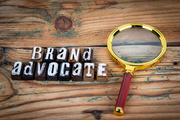 Wall Mural - brand advocate. alphabet letters on wood texture background