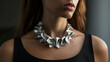 A modern sculptural necklace made entirely of 3D printed metal adding an avantgarde touch to any outfit.