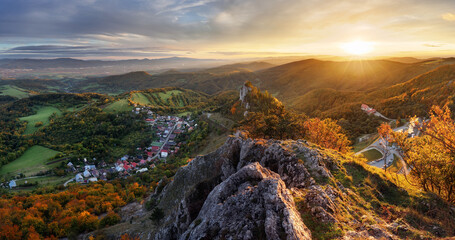 Wall Mural - beautiful panoramic view of colourful fall forest and mountains in vrsatec landscape. sunset or sunr