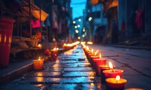 Lit Diya Lamp On Street At Night. Night Street Illuminated By Lit Diya Lamps, Festival Of Lights, Diwali Holiday Background With Rangoli