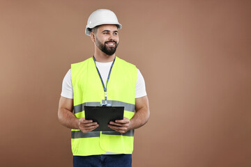 Sticker - Engineer in hard hat holding clipboard on brown background