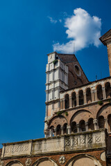 Wall Mural - Ferrara, Emilia Romagna, Italy. Detail of the Cathedral of San Giorgio, in the square of the same name. White marble and red bricks. UNESCO World Heritage Site.