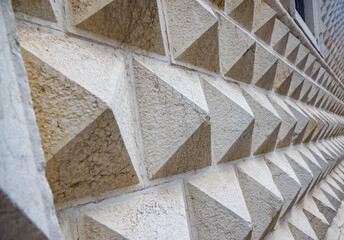 Wall Mural - Ferrara, Emilia Romagna, Italy. A detail of the Diamond Palace with its characteristic external walls, composed of ashlar, marble blocks in the shape of diamond tips, which give the palace its name.