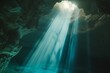 sunlight piercing through an opening of a submerged cave