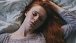 Top view of sick young ginger redhead woman lying in bed touch belly suffer from stomach ache, ill millennial girl struggle with periods pain, having eating disorder indigestion trouble top.