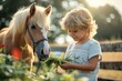 A young boy gently feeds a palomino horse with fresh greenery in a serene outdoor setting