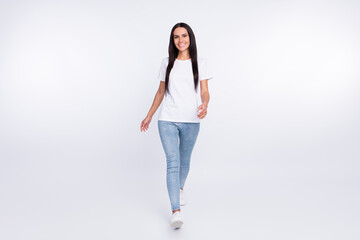 Wall Mural - Full length body size photo of walking forward girl wearing casual outfit isolated on white color background