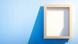 © Adam - Empty Picture Frame. Blank Wooden Frame Hanging on Blue Wall with Sunlight. Minimalistic Frame with Copy Space for Mockup Presentations in Interior Design and Art Gallery Concept.
