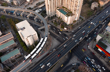 Wall Mural - Aerial top view, of expressway road traffic an important infrastructure and thailand mrt pink line new (Mass Rapid Transit) electric trains, road and roundabout, transportation and travel concept.