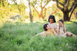 © Austockphoto - Portrait of mother and children sitting together in Australian bush setting