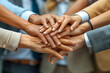 © Pramesti - Close Up of Hands Forming Teamwork Bond