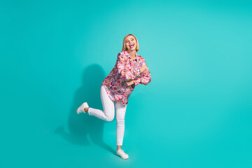 Sticker - Full length photo of eccentric ecstatic woman dressed print blouse white pants dancing on retro party isolated on teal color background