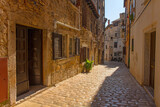 Fototapeta Uliczki - A quiet back street in the historic centre of the medieval coastal town of Rovinj in Istria, Croatia