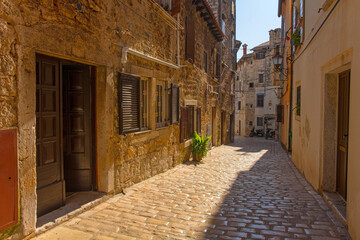 Wall Mural - A quiet back street in the historic centre of the medieval coastal town of Rovinj in Istria, Croatia