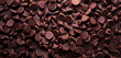assorted chocolate chips scattered background top view