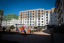 Residential Buildings With A Playground In The Courtyard