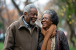© AI_images - Smiling and happy senior African American couple enjoys a leisure walk in the city park. They radiating happiness and warmth.
