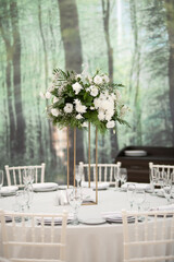 Wall Mural - Luxury wedding table setting with flower centerpieces and candles