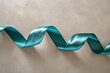 Teal green blue satin ribbon bow confetti scroll set isolated on gray background 