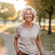 European woman smiling in the park. Portrait of a good looking middle aged Caucasian woman smiling at camera outdoors. Lovely happy middle aged European female walking in a garden. .