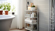 © Abbas Samar shad - A compact multipurpose storage rack in a bathroom, holding towels, toiletries, and skincare products, optimizing storage in a small space.