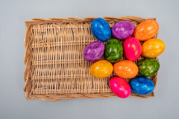 Colorful Easter eggs on table for celebration of catholic Easter in april, close up