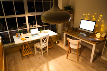 Sticker - Hanging lamp in modern office at night, closeup