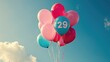 Pastel colored balloons with the number 29 printed. Concept of 29 february leap year day.