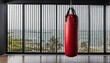 © ibreakstock - Healthy lifestyle and active sport concept with red punching bag, essential for kickboxing, Muay Thai, and Taekwondo