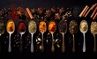 Various of colorful herbs and spices in spoons for cooking on wooden table. Asian, Italian or Indian seasoning. Cumin, chili pepper, curry powder, salt, pepper, garlic, cinnamon. Flat lay, top view
