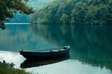 Fototapeta  - Serene lake scene with a solitary boat Encapsulating the beauty of nature and tranquility
