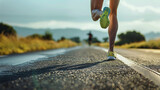 Fototapeta  - foto de pernas correndo em roupas esportivas ao longo de uma longa estrada
