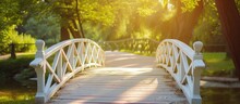 A Sunny Summer Day Illuminates A Picturesque Wooden Bridge In A City Park, Painted In White.