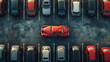 Top-down view of a red car standing out in a parking lot full of grey cars.