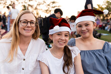 Mother And Daughters At The Christmas Carols