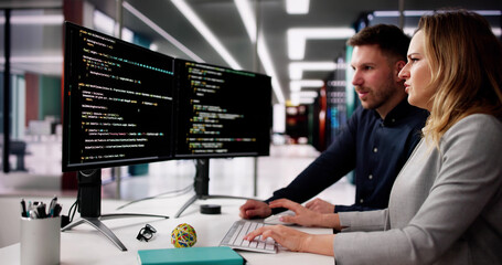 Wall Mural - coder using computer at desk