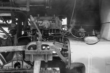 Interior Of An Old Steam Locomotive In Black And White.