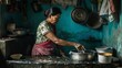 Mature Indian Woman Washing Utensils in Kitchen