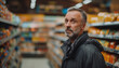 © PrabhjitSingh - Mature Shopper Searching at Supermarket for Everyday Essentials