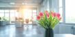 Tulips against renovated modern office space with panoramic windows. Natural light casts soft glow enhancing brilliance of tulips petals