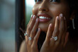 a model watching from window and her hands are out, ahe wore diamond ring on middle finger and oval shape diamond solitaire engagement ring on index finger she smiling